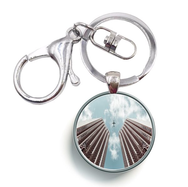 Airplane Flying over Big Buildings Designed Circle Key Chains For Discount